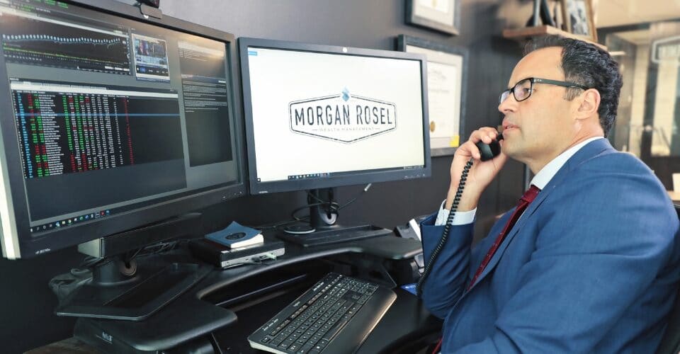 morgan rosel investment advisor in Denver talking on the phone 