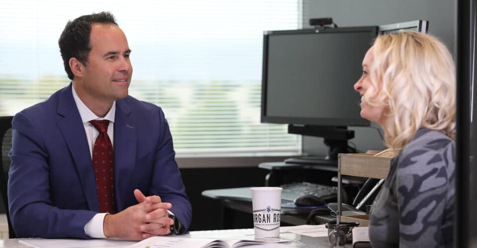 Smiling man providing wealth management advice