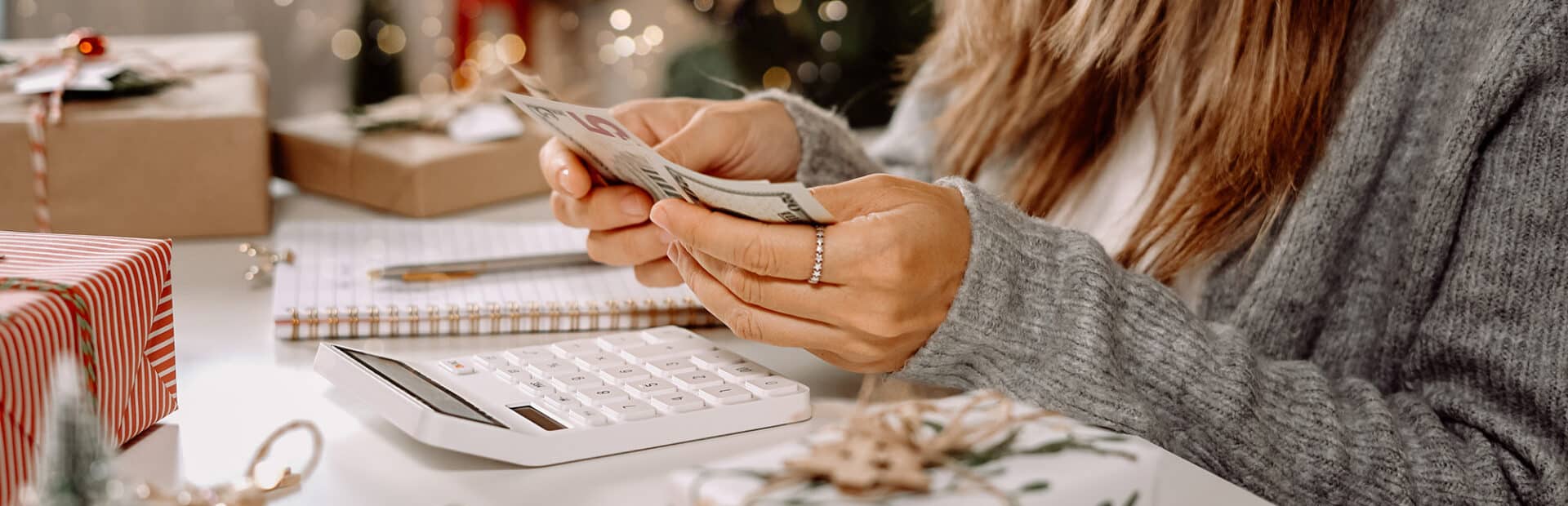 Person counting money from end of year investment strategies