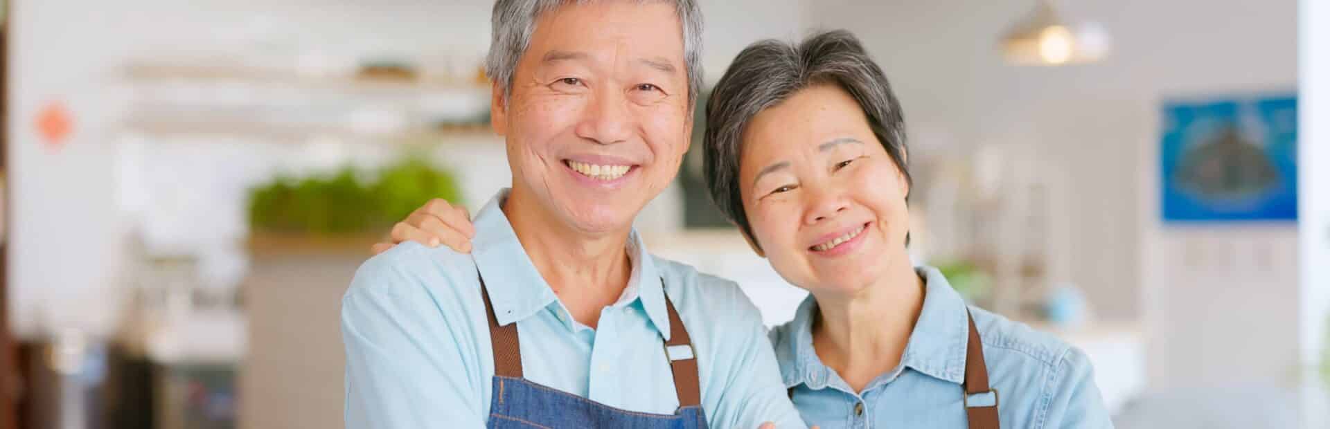 Elderly couple smiling after learning the value of their small business