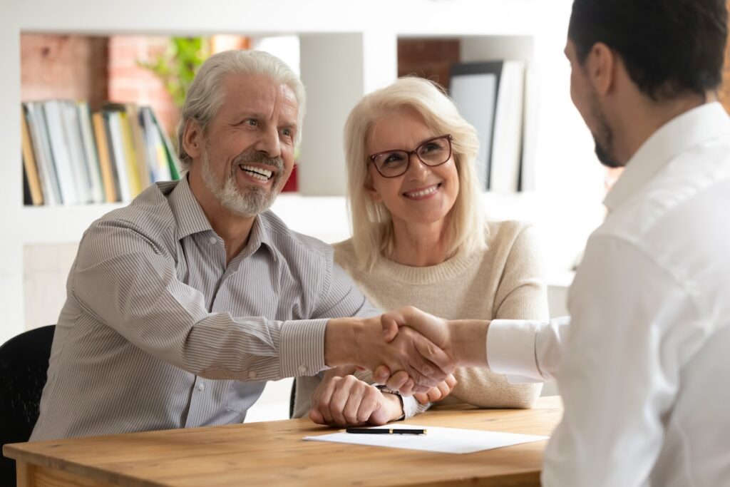 smiling couple receiving personalized wealth management